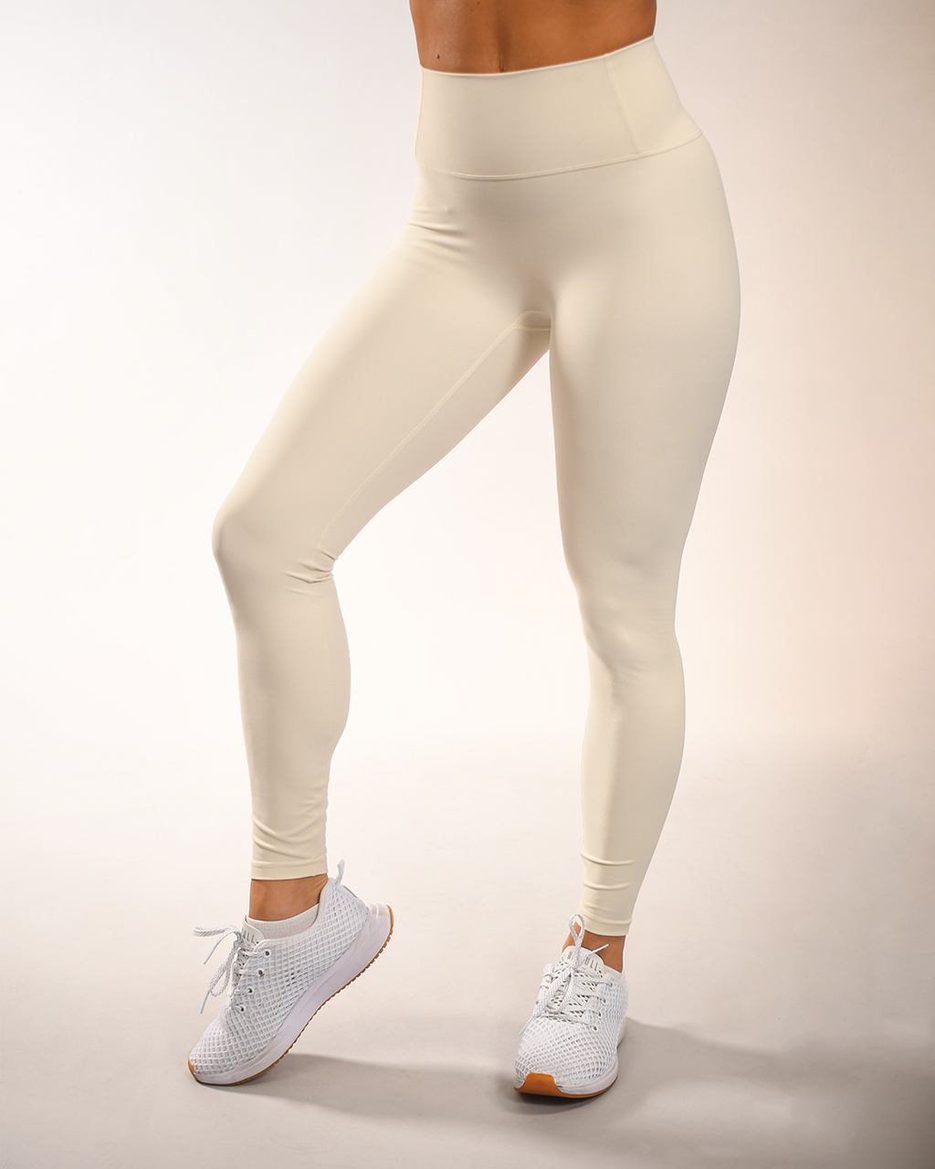 Closeup Of Woman With Large Waist And Big Sides Pulling Up Leggings On  Beige Background Body Positive Accepting Who You Are Tight Clothes Need For  Wardrobe Change Stock Photo - Download Image Now - iStock